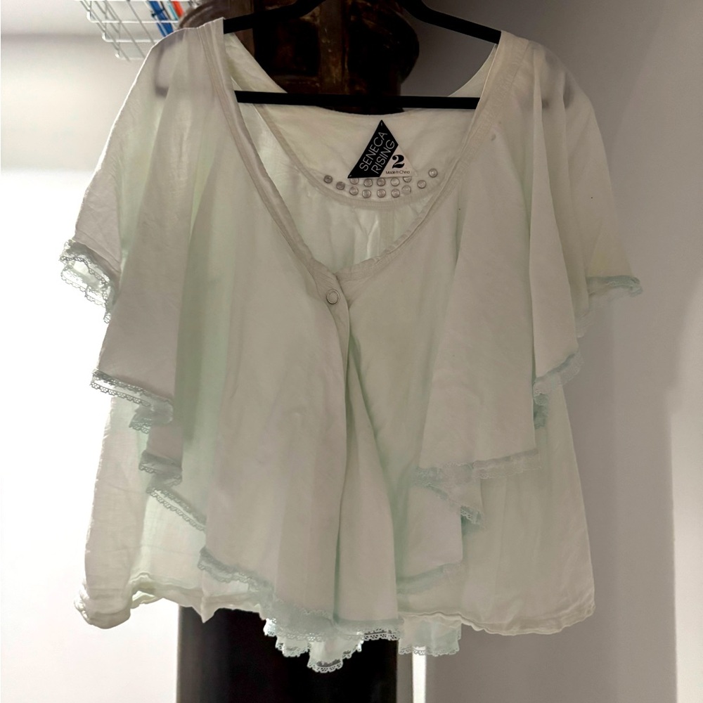 Seneca Rising light pastel seafoam greenish blue. 100% cotton layered but light.